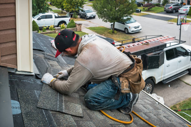 Professional Emergency Roof Repair technician working in Enosburg Falls, VT